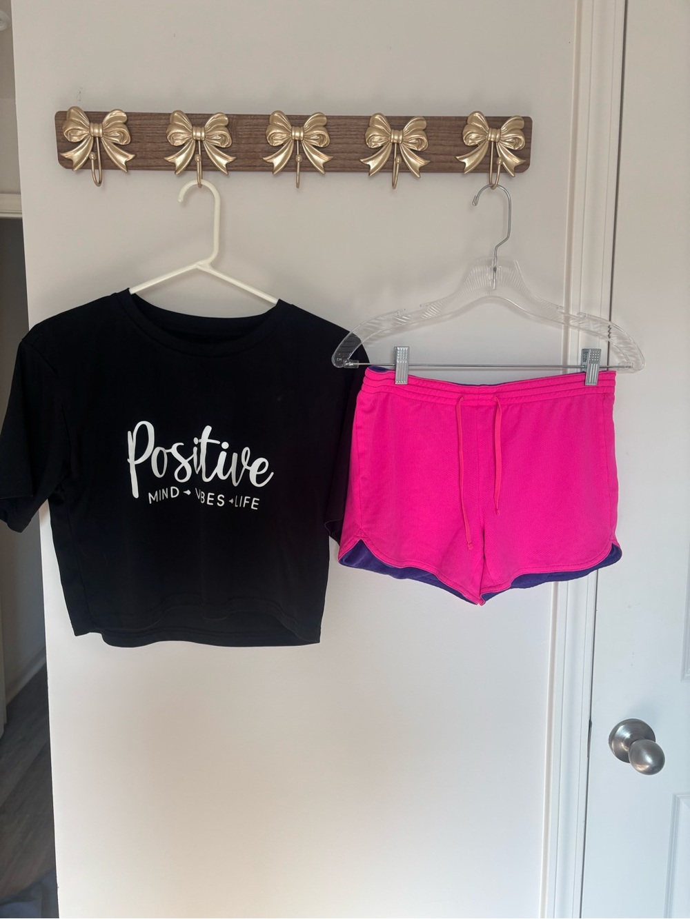 Pink and purple reversible workout shorts with crop top set